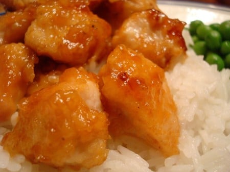 ChickenRicePeas2 Honey glazed chicken over white rice.