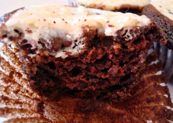 Black and white cupcake with bite taken out.