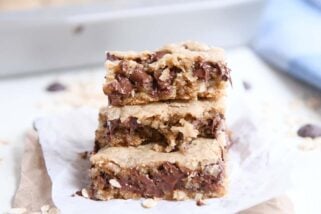 stack of three easy oatmeal chocolate chip coconut cookie bars on white napkin