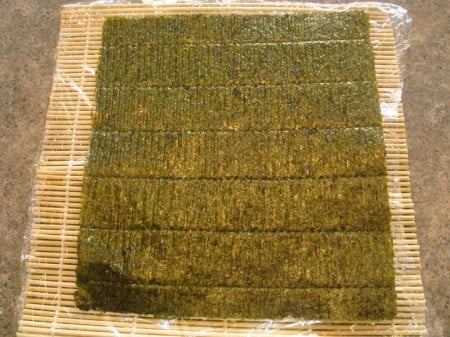 Just Seaweed sheet of nori laid flat on a bamboo mat