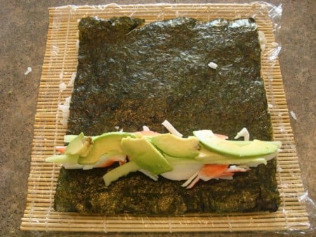 Rice Outside Layer1 crab meat, cucumber, and avocado on a sheet of nori
