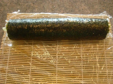 Rolled Roll At End of Mat sheet of nori rolled up on a bamboo mat