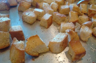 Baked Croutons baked bread cubes on a metal cookie sheet