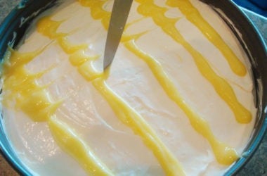 cheesecake with lemon curd designs on top