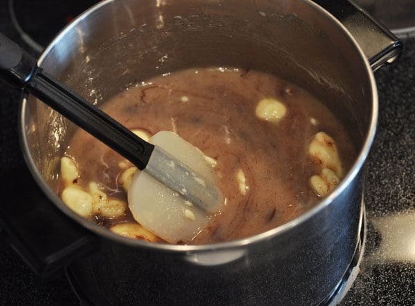 ingredients for chocolate caramel melting in a large pot
