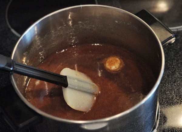 chocolate caramel liquid in a large stainless steel pot