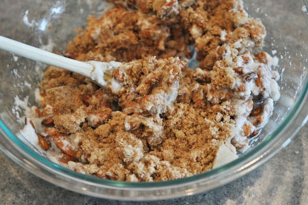glass bowl with almonds and brown sugar mixture