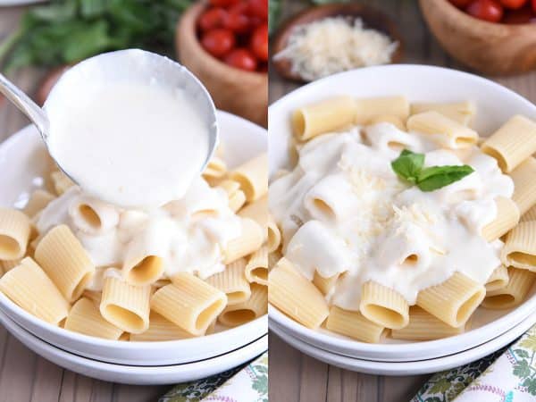Pouring homemade alfredo sauce recipe over cooked rigatoni.