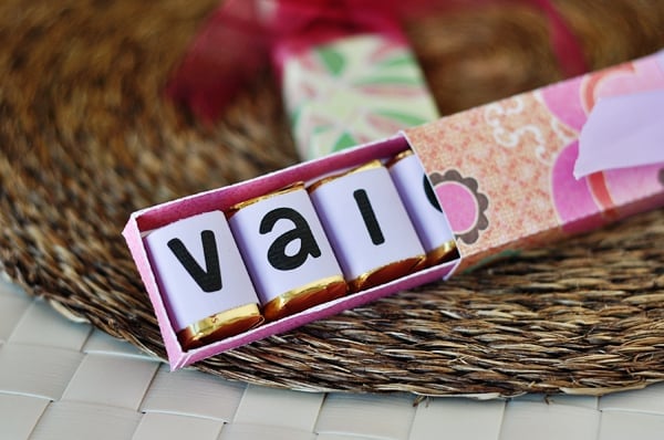 homemade chocolate box half open showing 3 wrapped chocolates