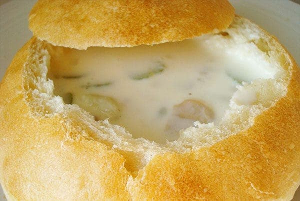 Bread bowl filled with clam chowder.