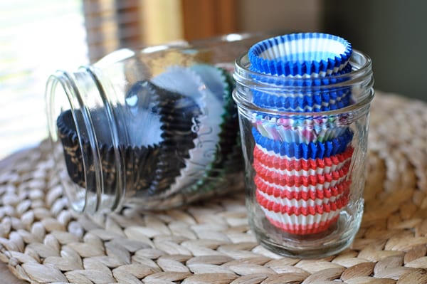 glass mason jars full of muffin cup liners