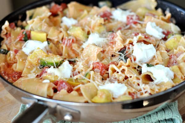 A skillet full of cooked skillet summer vegetable lasagna.