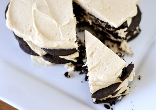 Top view of a chocolate and peanut butter wafer cream cake with a slice cut out.