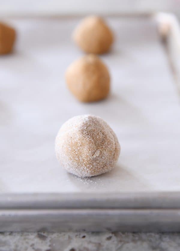 Ginger molasses cookie dough balls rolled in sugar.