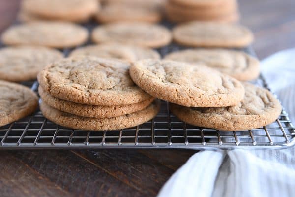 Soft and chewy ginger molasses cookies on cooling rack.
