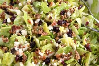 Romaine salad in white bowl.