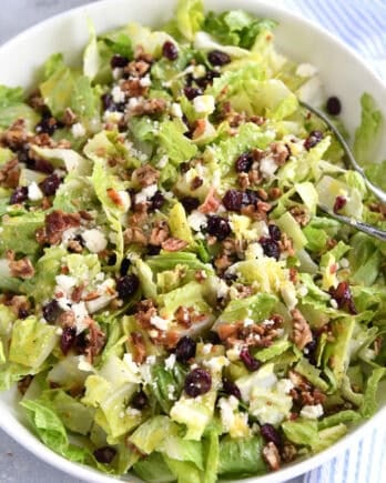 Romaine salad in white bowl.