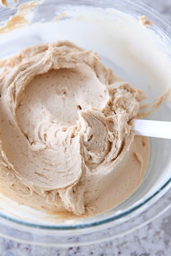 Bowl of creamy peanut butter frosting.