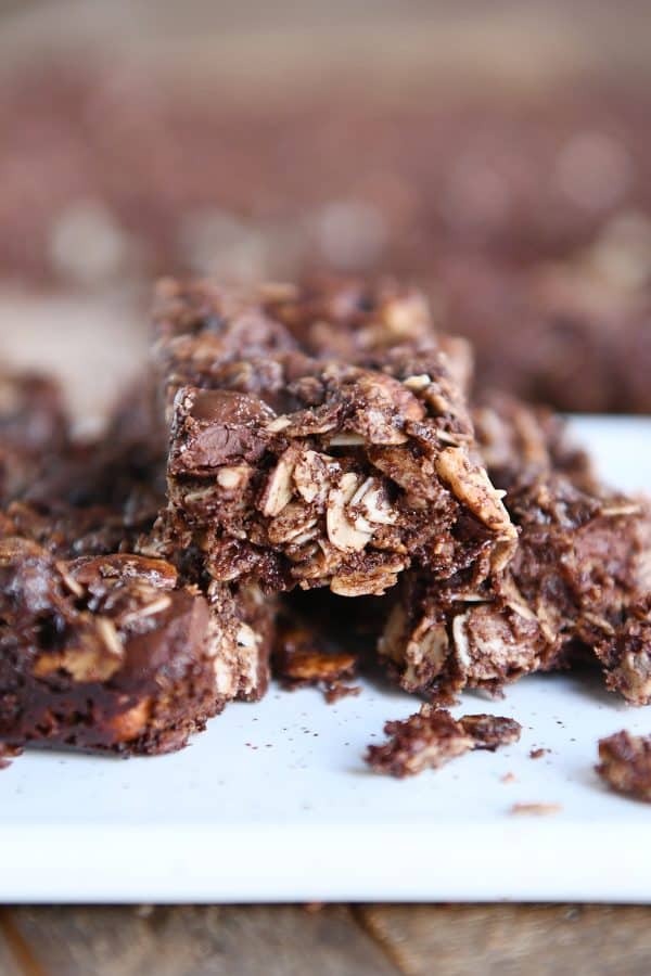 Close view of broken dark chocolate brownie granola bar.