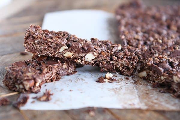 Dark chocolate brownie granola bar on parchment paper.