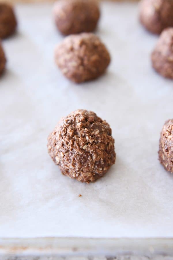 Baked chocolate peanut butter granola bite on sheet pan.