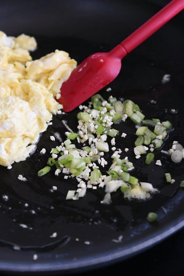 Cooking onions and garlic in skillet for easy ham fried rice.