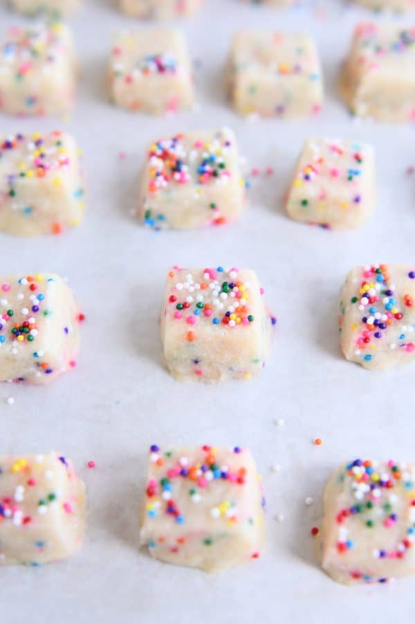 Baked funfetti shortbread bites on baking tray.