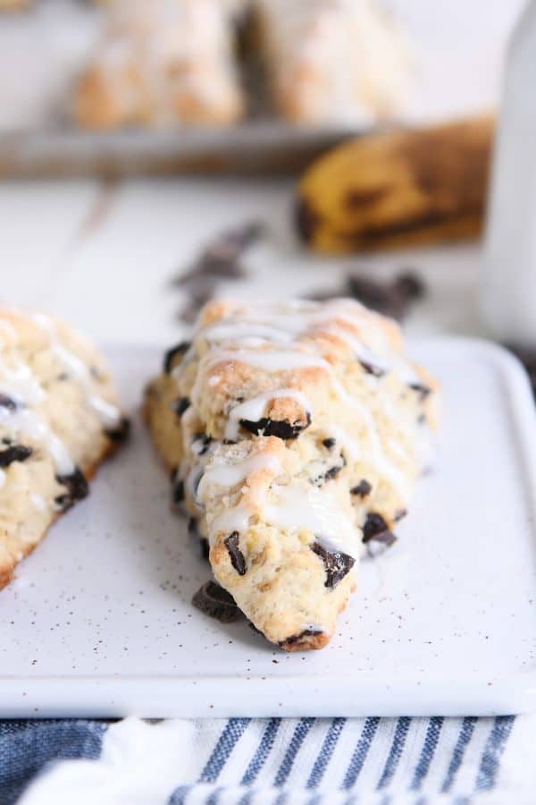 Baked banana bread scone on white tray.