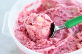 scooping out pink sorbet with ice cream sorbet