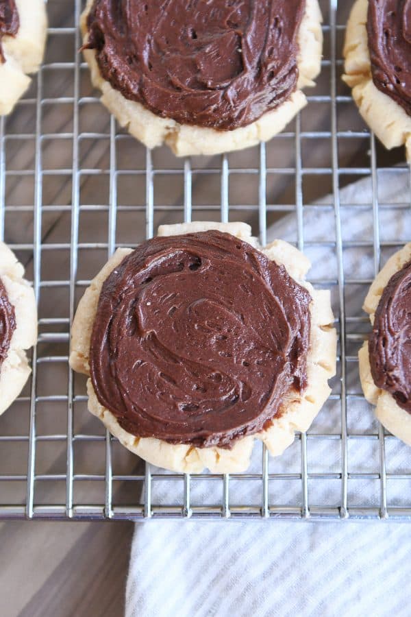 Top down view of peanut butter sugar cookie on wire rack.