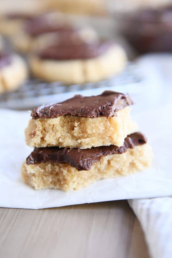 Broken soft peanut butter cookie in half and stacked on each other.