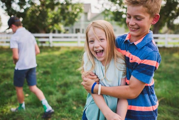 brother hugging sister