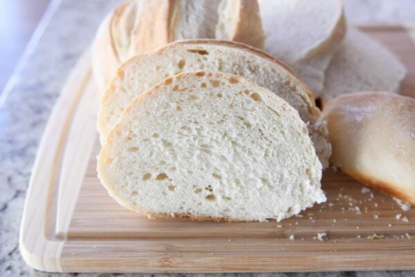 Slices of sourdough bread on cutting board.