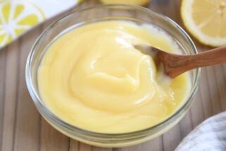 glass bowl with easy instant pot lemon curd and wooden spoon