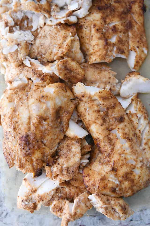 Cooked white fish with seasonings for the best fish tacos.