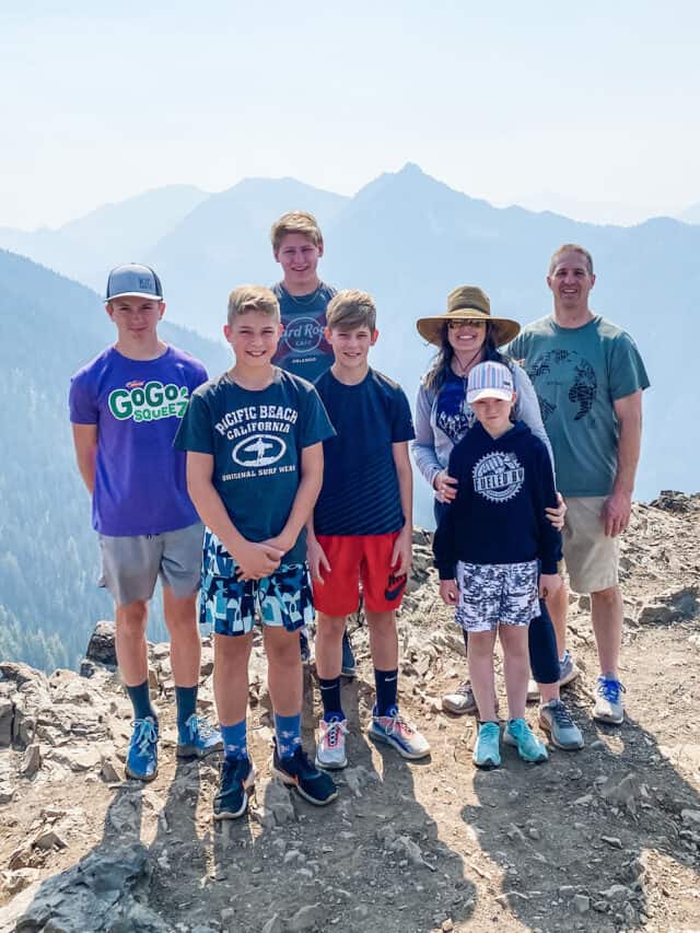 Family standing at edge of mountain.