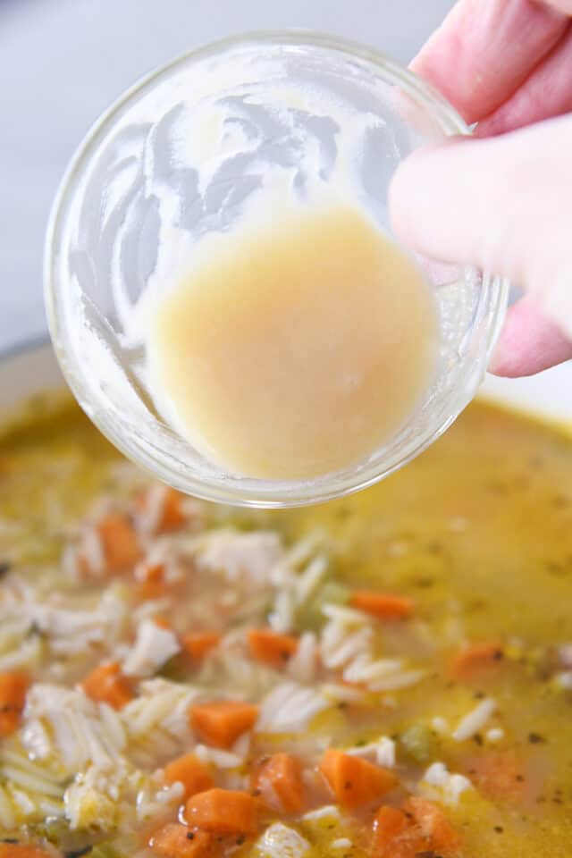 Adding butter and flour roux to lemon chicken orzo soup.