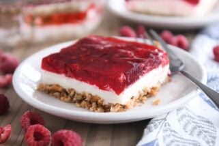 square of raspberry pretzel jello on white plate