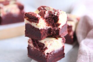 two red velvet brownies stacked on each other