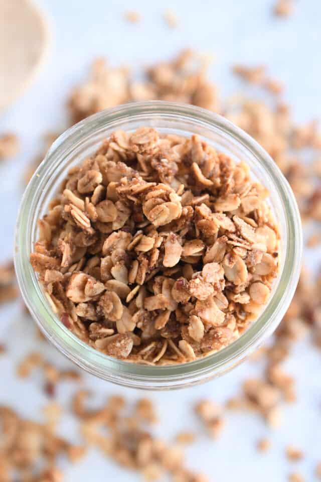 Glass jar with cinnamon granola.