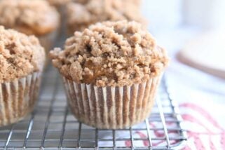 Pumpkin snickerdoodle muffin on cooling rack.