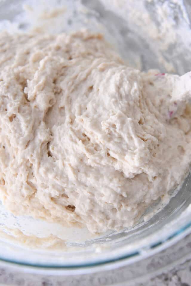 Biscuit dough in glass bowl.