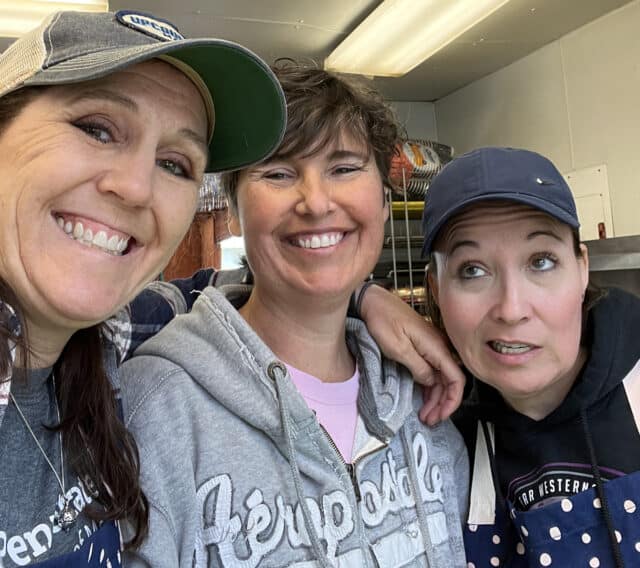 Three adult leaders making silly faces for camera.