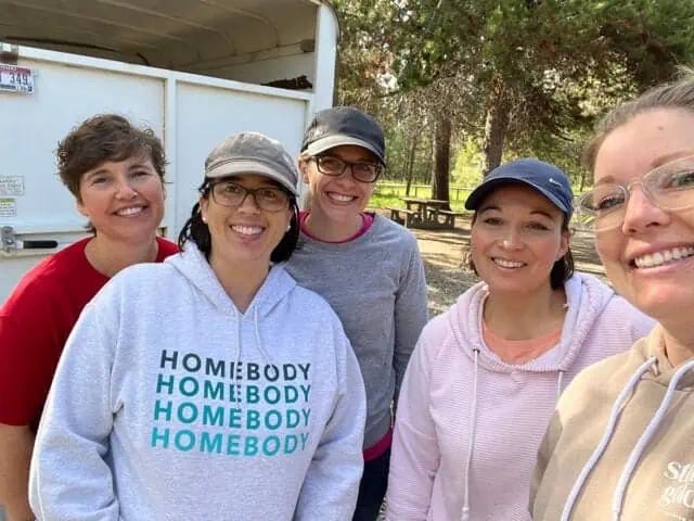 Five adult women smiling for picture.