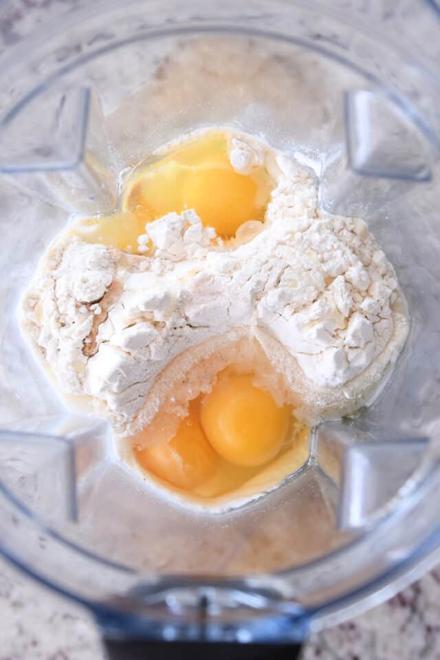 Eggs, flour and milk in blender.