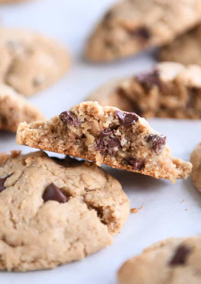 Cookie broken in half and leaning against full cookie.
