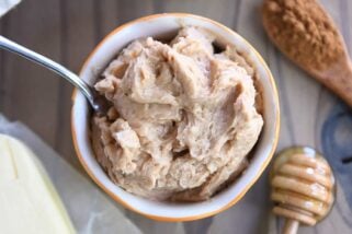 Cinnamon honey butter in bowl with knife.