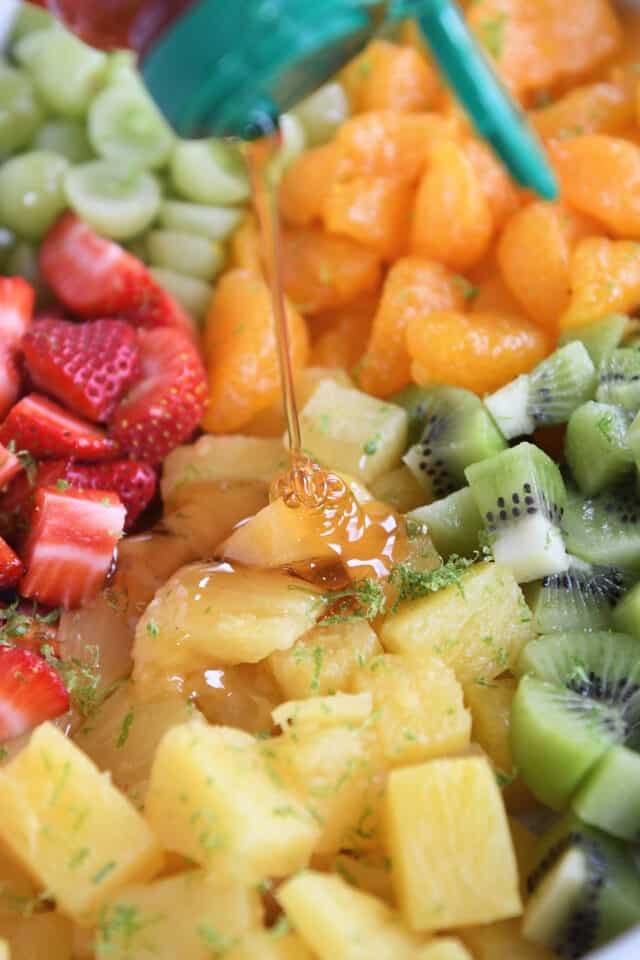 Honey drizzled on top of canned pineapple.