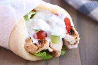Chicken gyro wrapped in parchment paper.