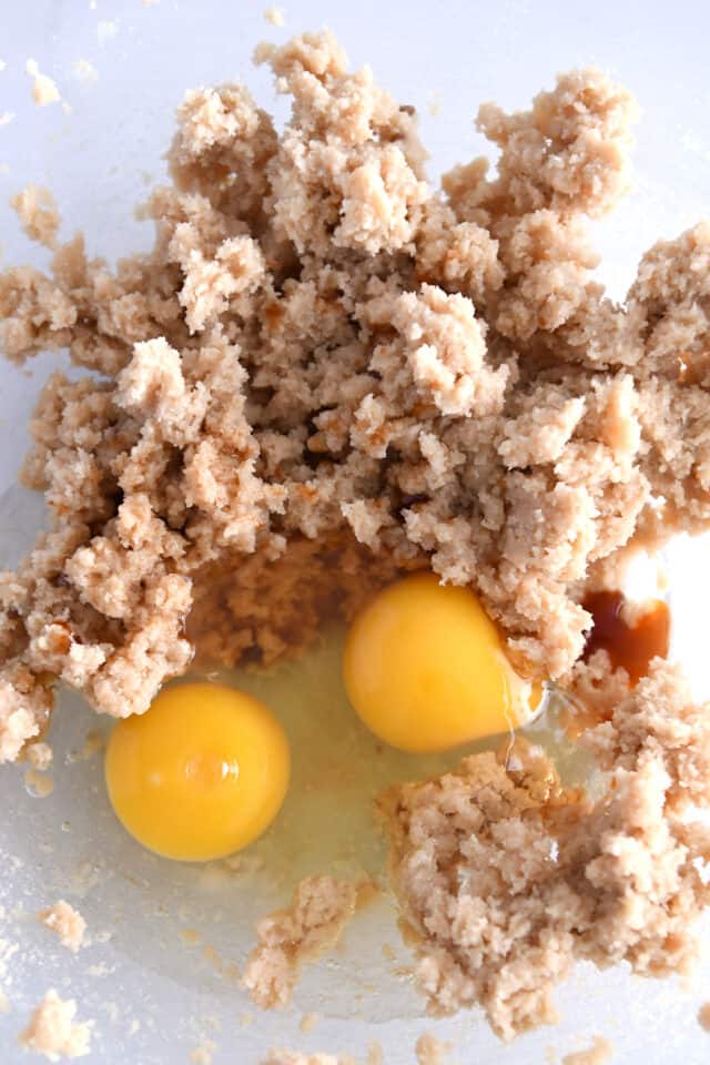 Glass bowl with butter, sugar and eggs.